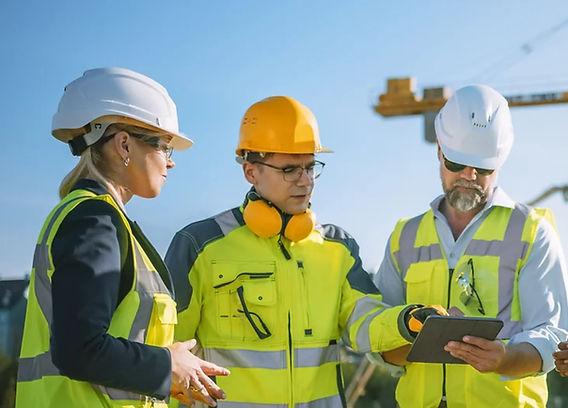 HSE advisor reviewing site documentation with project management