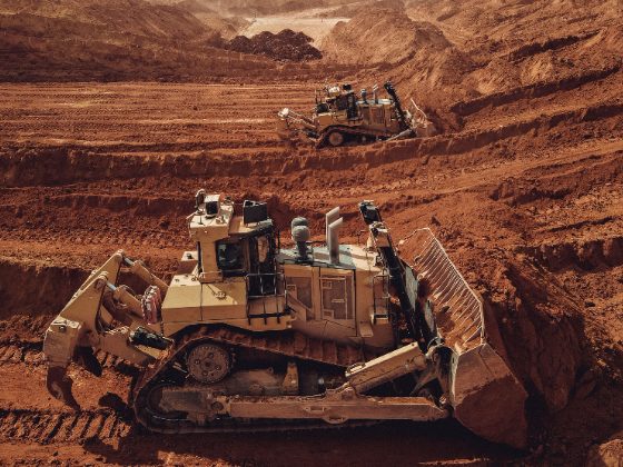 Dozers working the benches of an open-pit iron ore mine